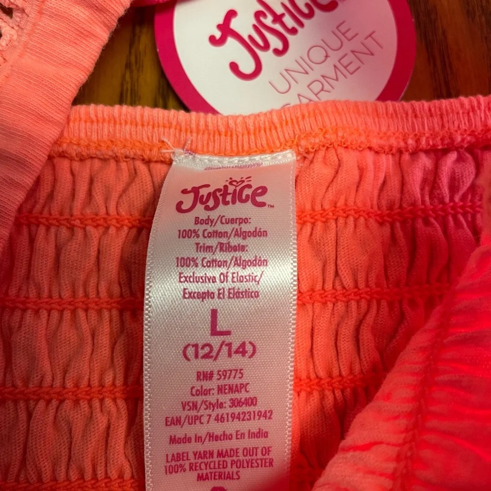 New Justice Girls orange smocked ruffle orange dye top. Size L 12/14